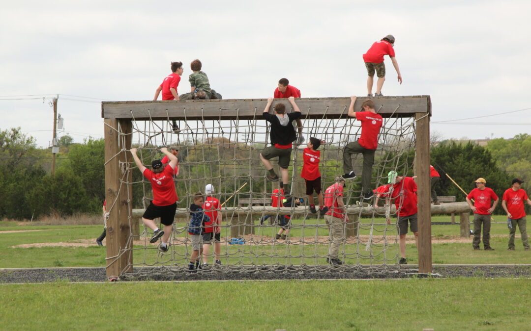 Climbing the ropes course at Fort Hood